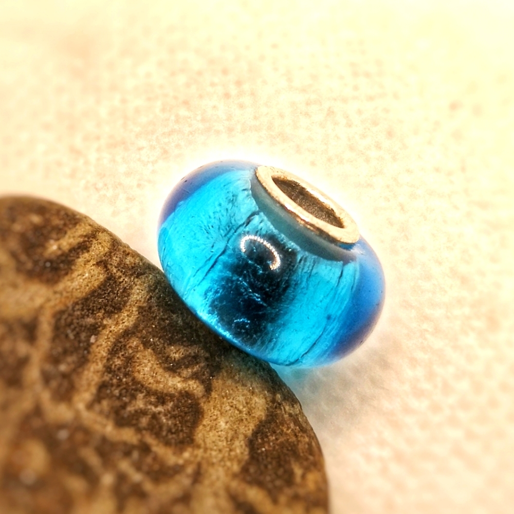 Silver and glass bead charm